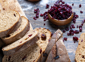fresh cut bread made of flour and dried cranberries