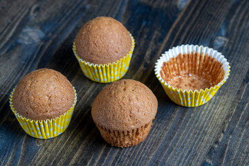 delicious wheat cupcakes on a black wooden table