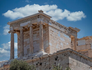 Clouds over Athena Nike (victorious) ancient temple on Acropolis, Athens, Greece