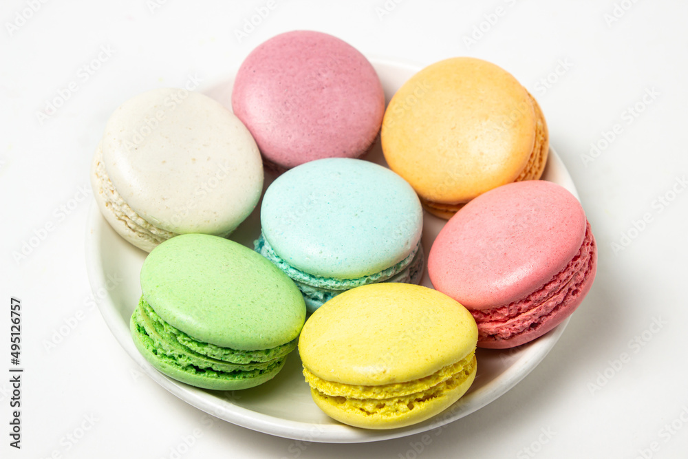 Sticker Colored macarons on a white background. Light and tasty dessert. traditional dessert