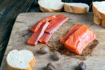 red salted salmon fish meat on a chopping board