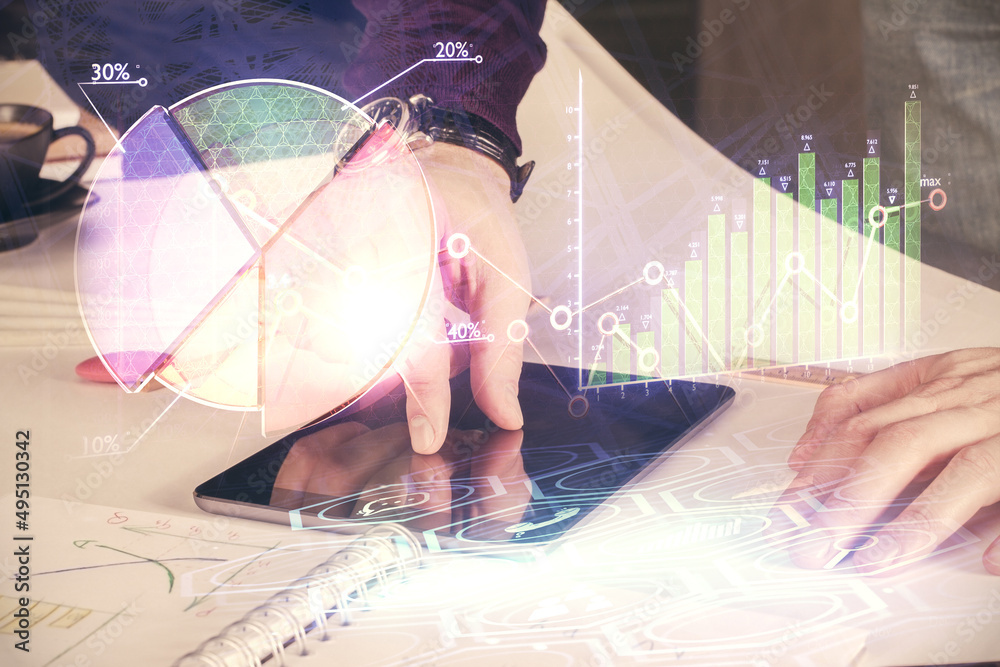 Aufkleber double exposure of man's hands holding and using a digital device and forex graph drawing. financial