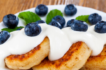 ripe and healthy blueberries with sauce and harvested
