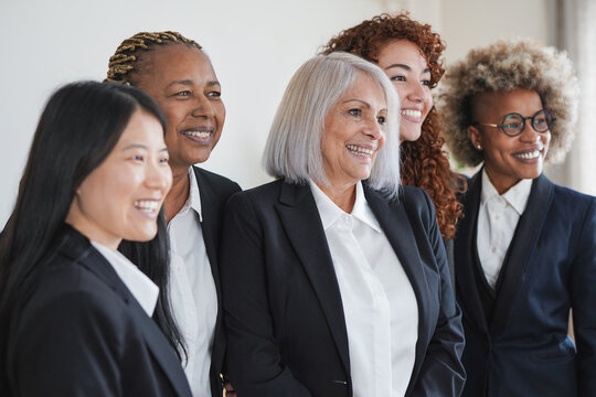 Multiracial business women working inside modern office 