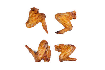Fresh roasted chicken wing quarters on white isolated background