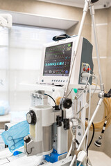 Patient monitor with vital signs in operating room vertical photo