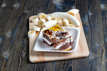 a piece of banana cake and fresh sliced bananas