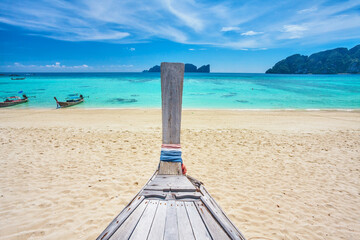 Longtale boat on the white beach at Phi Phi, Thailand