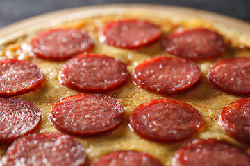 Pepperoni pizza whole, close-up, selective focus.