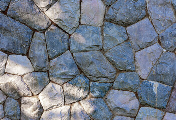 Walls made of stone, stone background, texture of a stone wall. Stone wall close up, background or texture. Old castle stone wall texture background