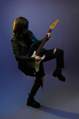 Fototapeta premium Female rock star playing the guitar