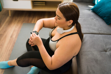 Using a fitness tracker on her smartwatch