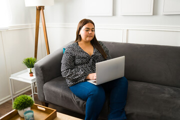 Attractive fat woman using a laptop
