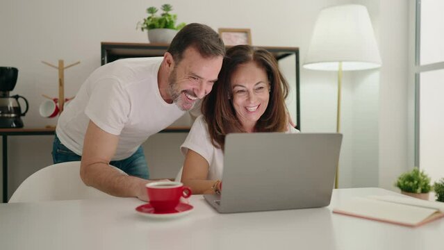 Man and woman couple having video call at home