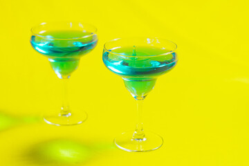 Bartender pouring Blue Lagoon  curacao syrup mixed with vodka
