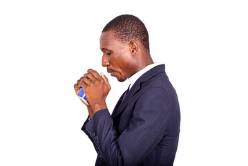 adult businessman blowing in a small cup of coffee.