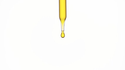 Macro shot of lab dropper with yellow oil on white background | Abstract skin care formulation...