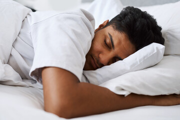 Nothing is more important than my sleep. Cropped shot of a young man sleeping in his bed.