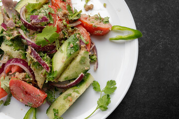 Summer vegetable salad of cucumbers, tomatoes and onions