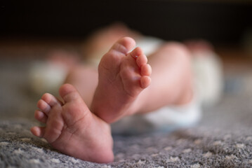 Small legs of a newborn macro
