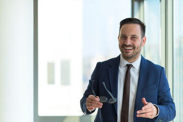 portrait of successful young manager discussing during meeting break