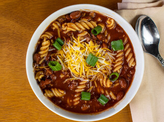 chili rotini  top with  chedder jack cheese and green onions