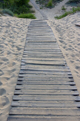 Boardwalk leading to the beach on the sand