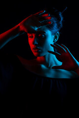 Portrait of a woman with colored lights	
