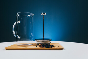 tea infuser set for making fruit tea on a white table in the background blue wall