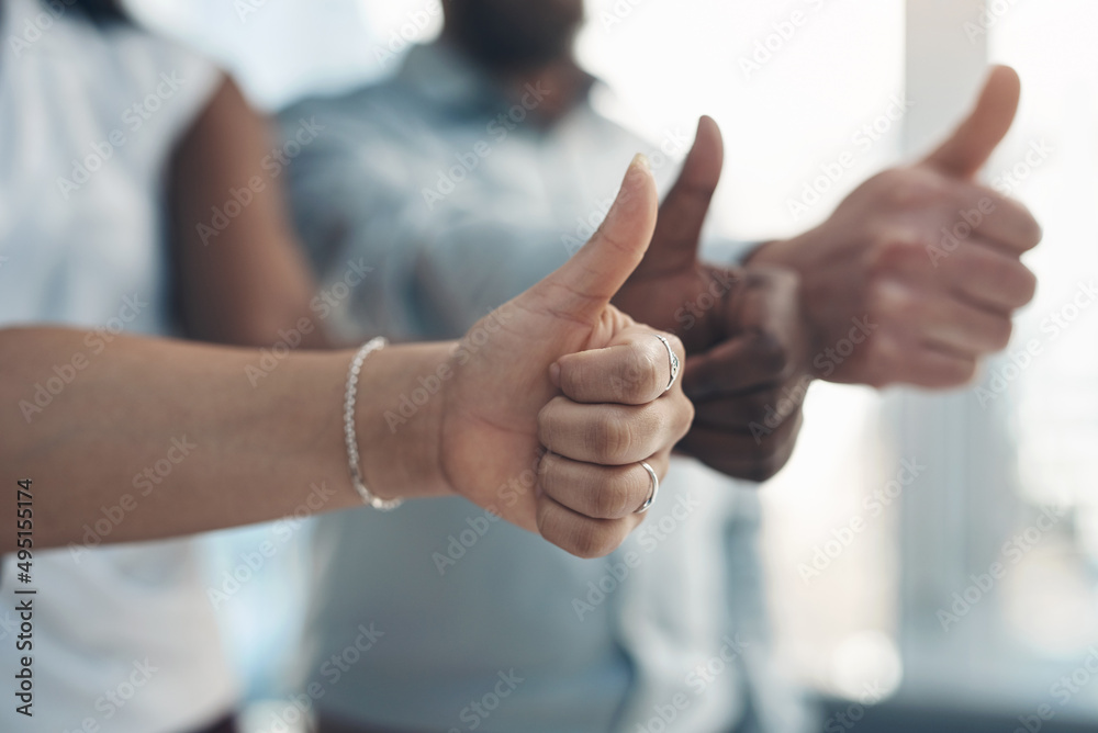 Poster time to go all the way with our business. cropped shot of an unrecognizable group of businesspeople 