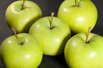 white apple on black background