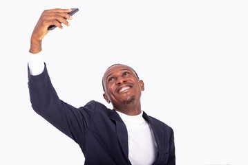 adult businessman taking photos with mobile phone in hand.