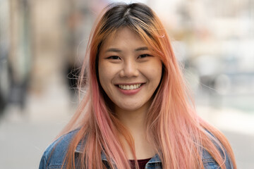 Young Asian woman with pink hair smile happy face portrait - Powered by Adobe
