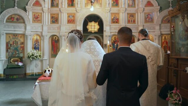 Bride and groom on a church wedding, rear view