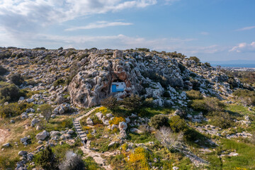 Fototapeta na wymiar Christian orthodox cave church. Agioi Saranta holy chapel Protaras Cyprus from drone view
