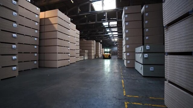forklifts transport pallets with OSB boards