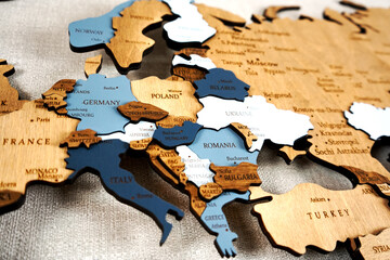 Europa on the political map. Wooden world map on the wall. Italy, Austria, Germany, Poland and other countries