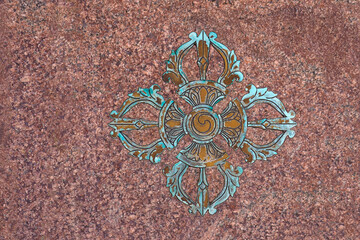 Tibetan Buddhist sign Vishwa Vajra in marble