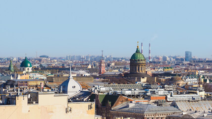 Fototapeta na wymiar Top view of the historic city center of St. Petersburg, Russia. Cityscape with roofs of buildings and Kazan Cathedral in sunlight day. Landmarks of Saint Petersburg, Russia