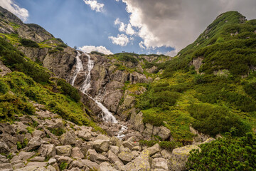 Zakopane, Poland : Siklawa waterfall or Wielka Siklawa in the High Tatras, on the Roztoka stream. It falls from the pond wall separating valleys of Pieciu Stawow Polskie and Roztoki. - obrazy, fototapety, plakaty