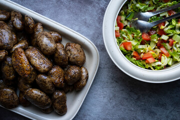 Mombar in ِArabic or what is also called Fawaregh is simply stuffed sheep sausages with rice and hummus