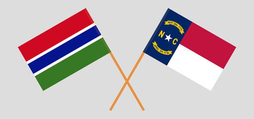 Crossed flags of the Gambia and The State of North Carolina. Official colors. Correct proportion