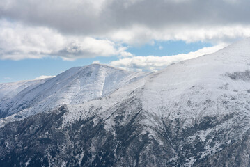 Winter landscape of the highlands. Mountain slopes and peaks covered with snow. Close-up shot, cropped image. Location Carpathians of Romania. Transfagarasan road, Transylvania.