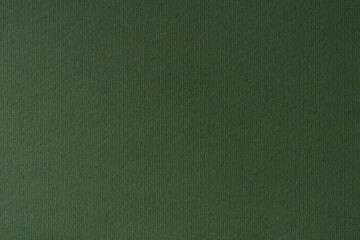Dark green paper texture background. Close-up of drawing and fine art paper.
