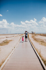 Dad and daughter walk to lookout point Badlands National Park, SD