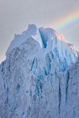 large icebergs floating in the sea in the arctic circle