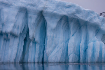 large icebergs floating in the sea in the arctic circle