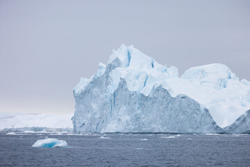 large icebergs floating in the sea in the arctic circle