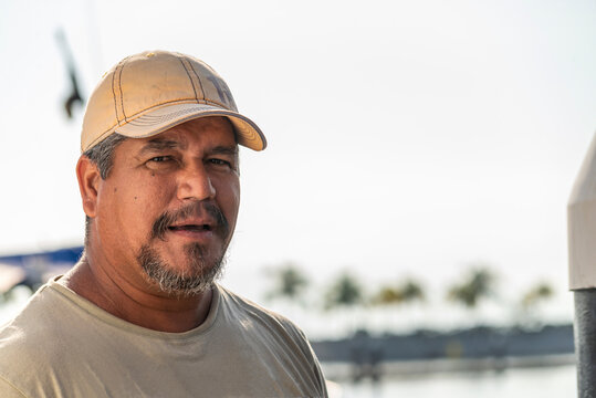 Portrait Of A Mature Latin Fisherman Interviewed At The Dock