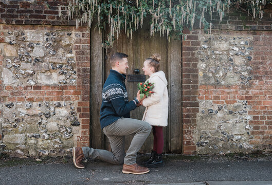 father giving his daughter flowers whilst taking her on a date